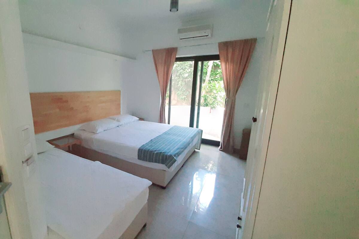 Standard Triple Room, 1 Bedroom, Garden View | Balcony
