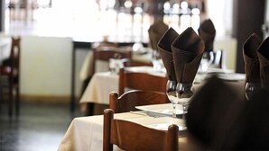 A restaurant interior with tables set for dining, featuring wooden chairs and a clean, organized layout. - Hotel Aquarius (Cattolica)