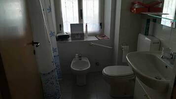 Combined shower/bathtub, free toiletries, hair dryer, bathrobes