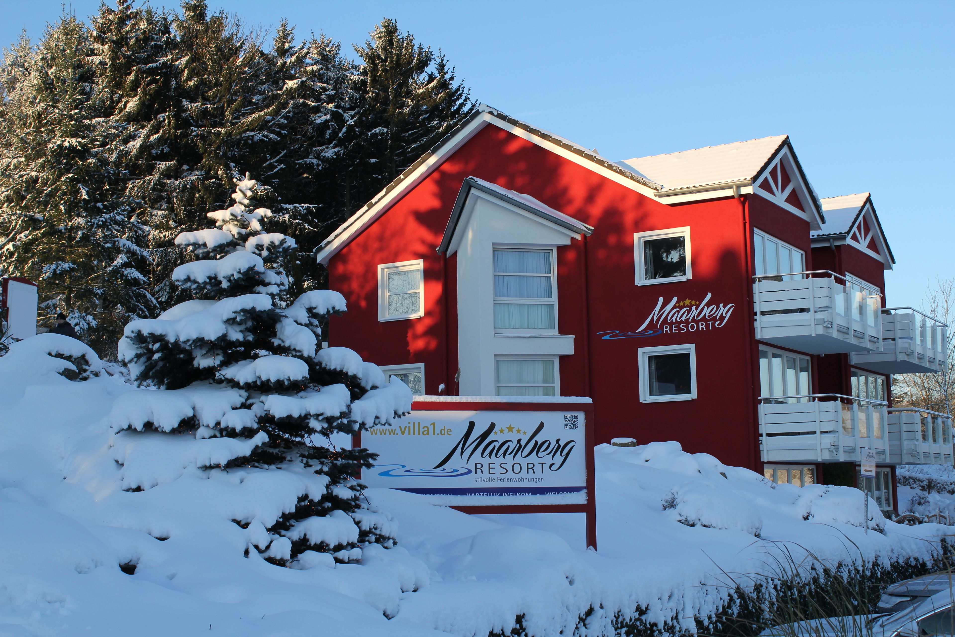A red building with a sign that reads "Maarberg Resort."