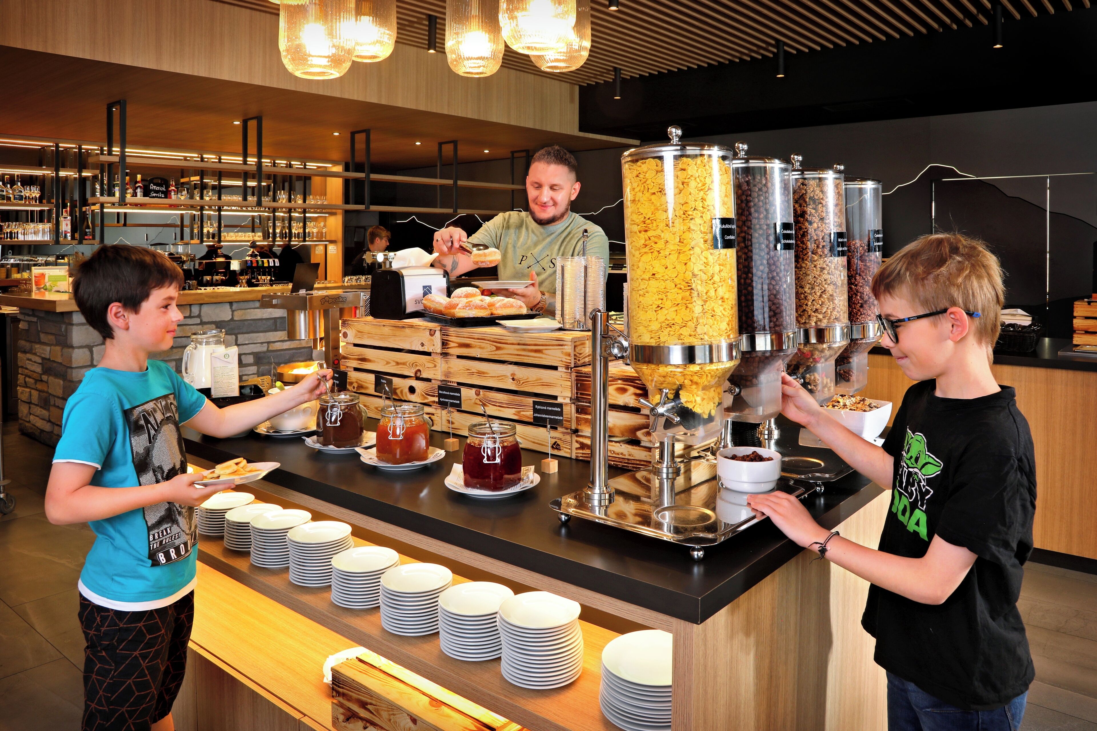 A buffet setup with various food items and a coffee machine.