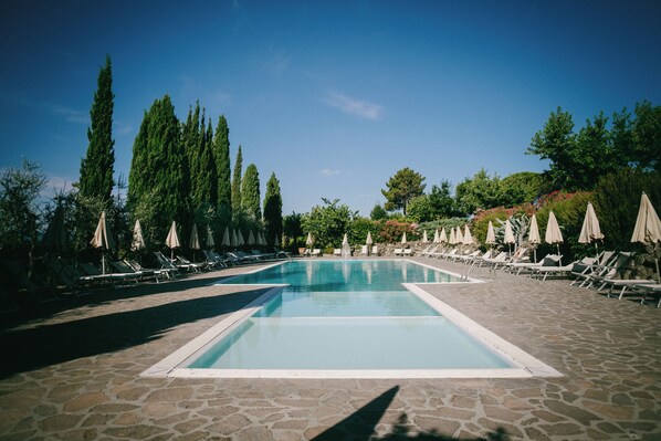 Seasonal outdoor pool, pool umbrellas, pool loungers