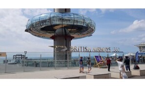 A glass-domed structure with the text "BRITISH AIRWAYS 360" on a building in the background.