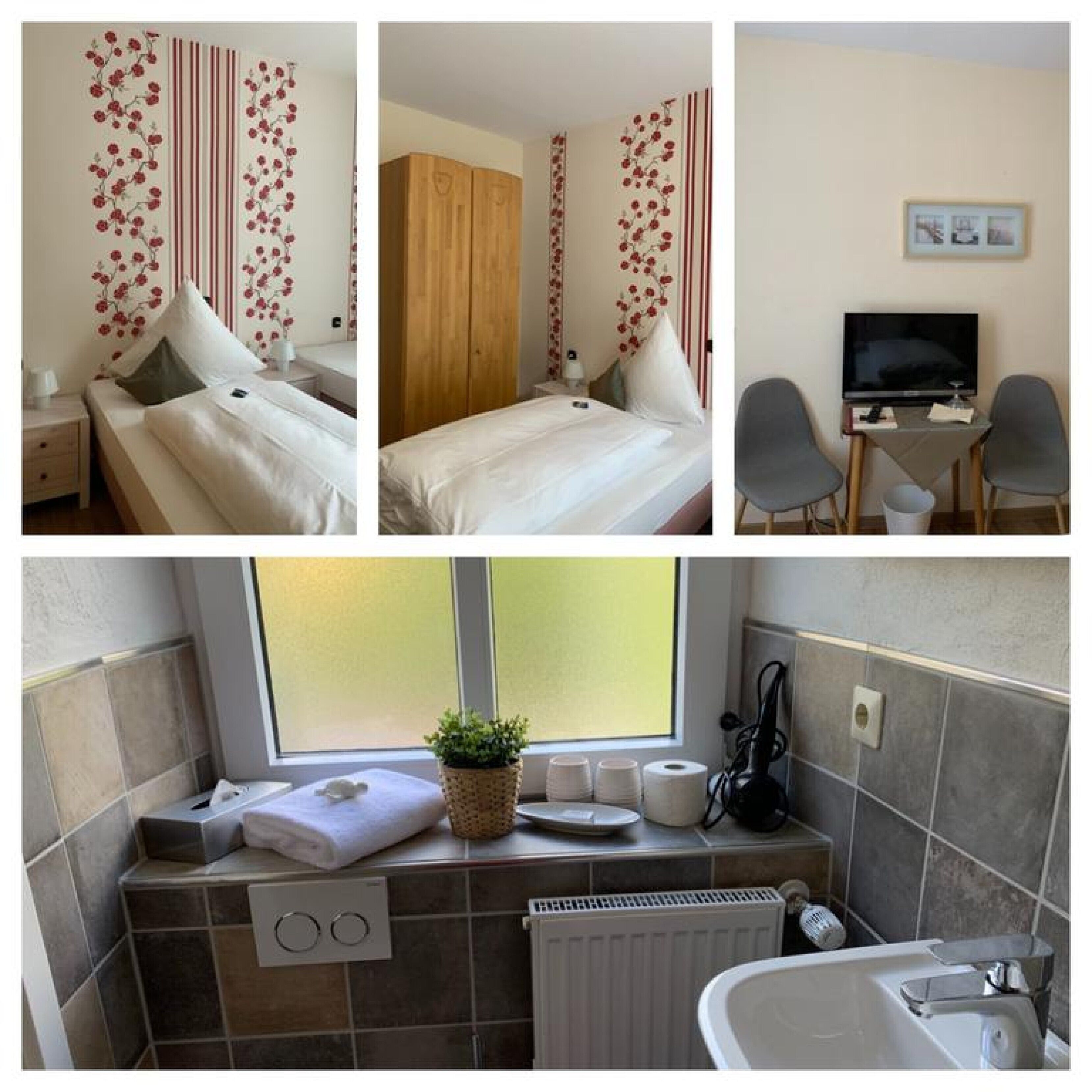 A hotel room with a bed, a desk with a TV, and a bathroom with a window, towel, and toiletries.