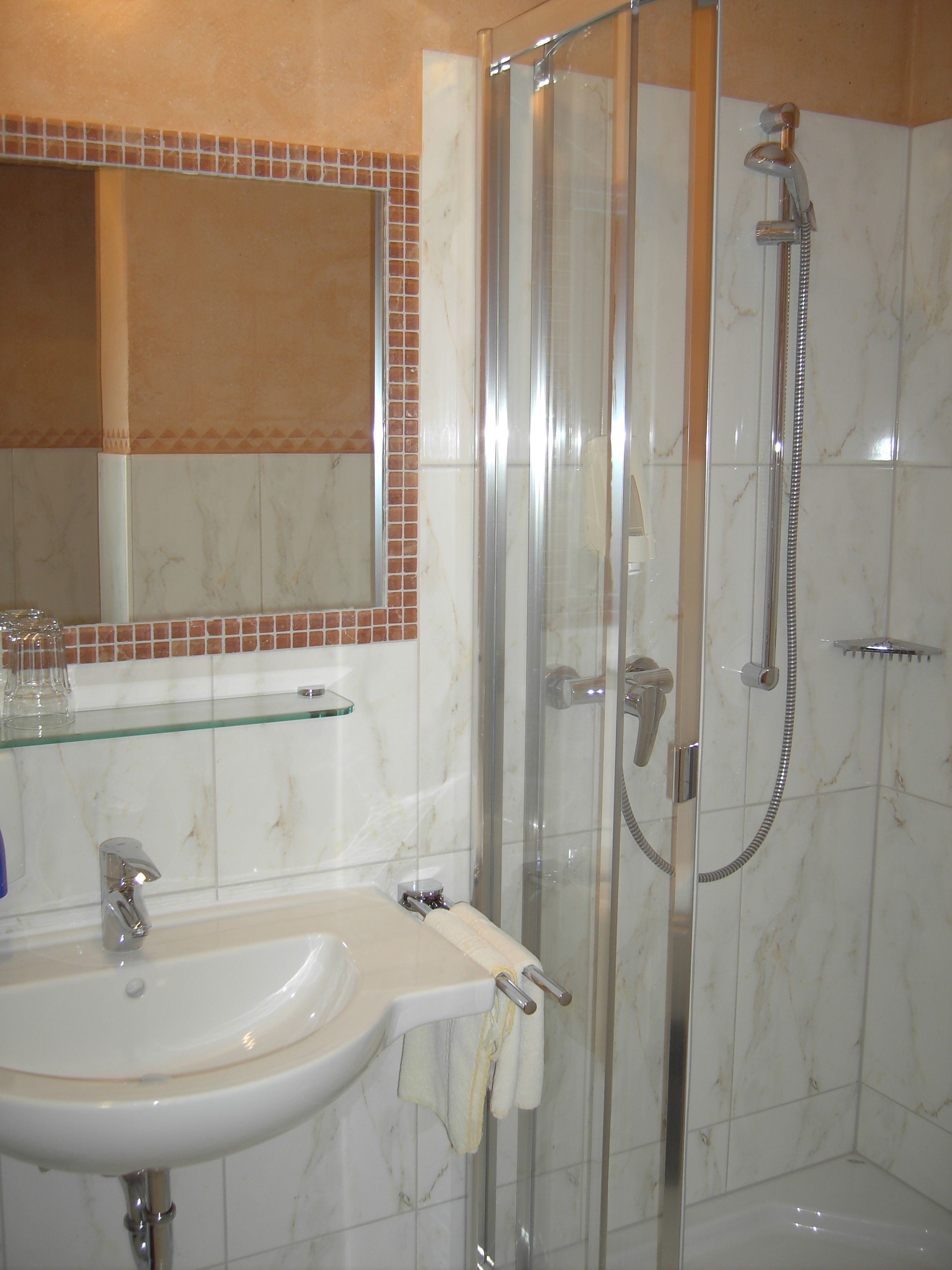 standard single room | bathroom | shower, rainfall showerhead, hair dryer, bathrobes
