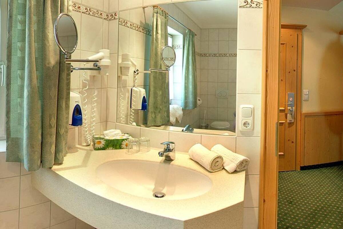 superior double room | bathroom | shower, rainfall showerhead, hair dryer, bathrobes