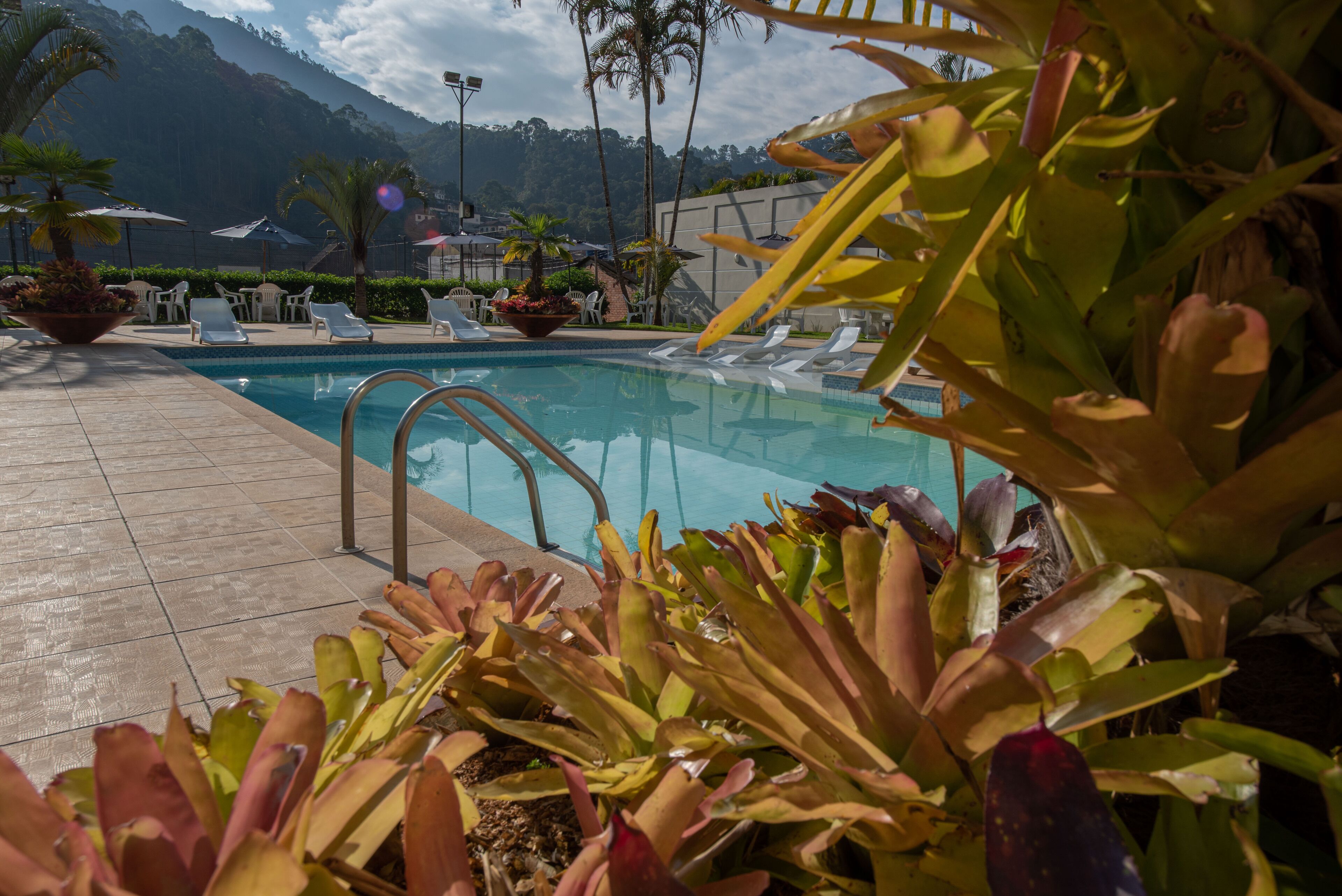 indoor pool, outdoor pool, pool loungers