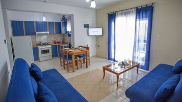 Apartment (4 Adults) | Living area | 32-inch flat-screen TV with digital channels, TV