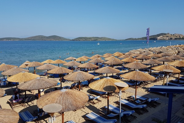 On the beach, sun loungers, beach umbrellas, beach towels