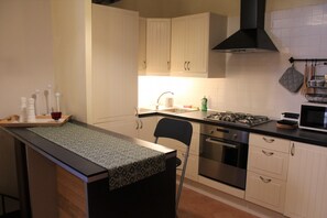 Apartment | Private kitchenette | Fridge, microwave, oven, stovetop