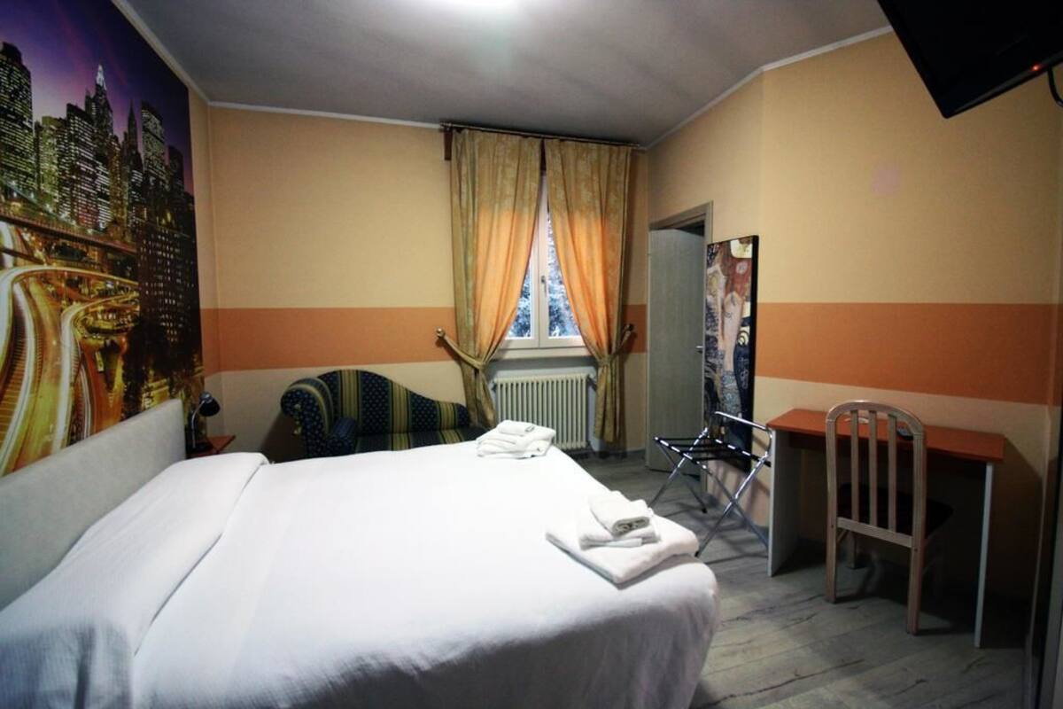 Chambre quadruple | Lit de bébé (supplément), accès au Wi-Fi (inclus), literie fournie