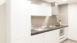 Family Apartment, 2 Bedrooms | Private kitchen | Full-sized fridge, microwave, stovetop, coffee/tea maker - Aparthotel Meseguer (Alcaniz)