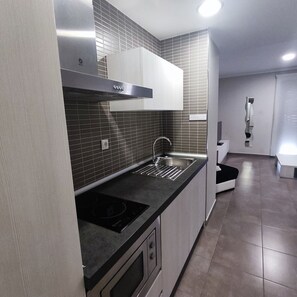 Basic Apartment | Private kitchen | Full-sized fridge, microwave, stovetop, coffee/tea maker - Aparthotel Meseguer (Alcaniz)