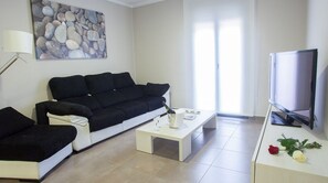 Family Apartment, 2 Bedrooms | Living area | Flat-screen TV - Aparthotel Meseguer (Alcaniz)