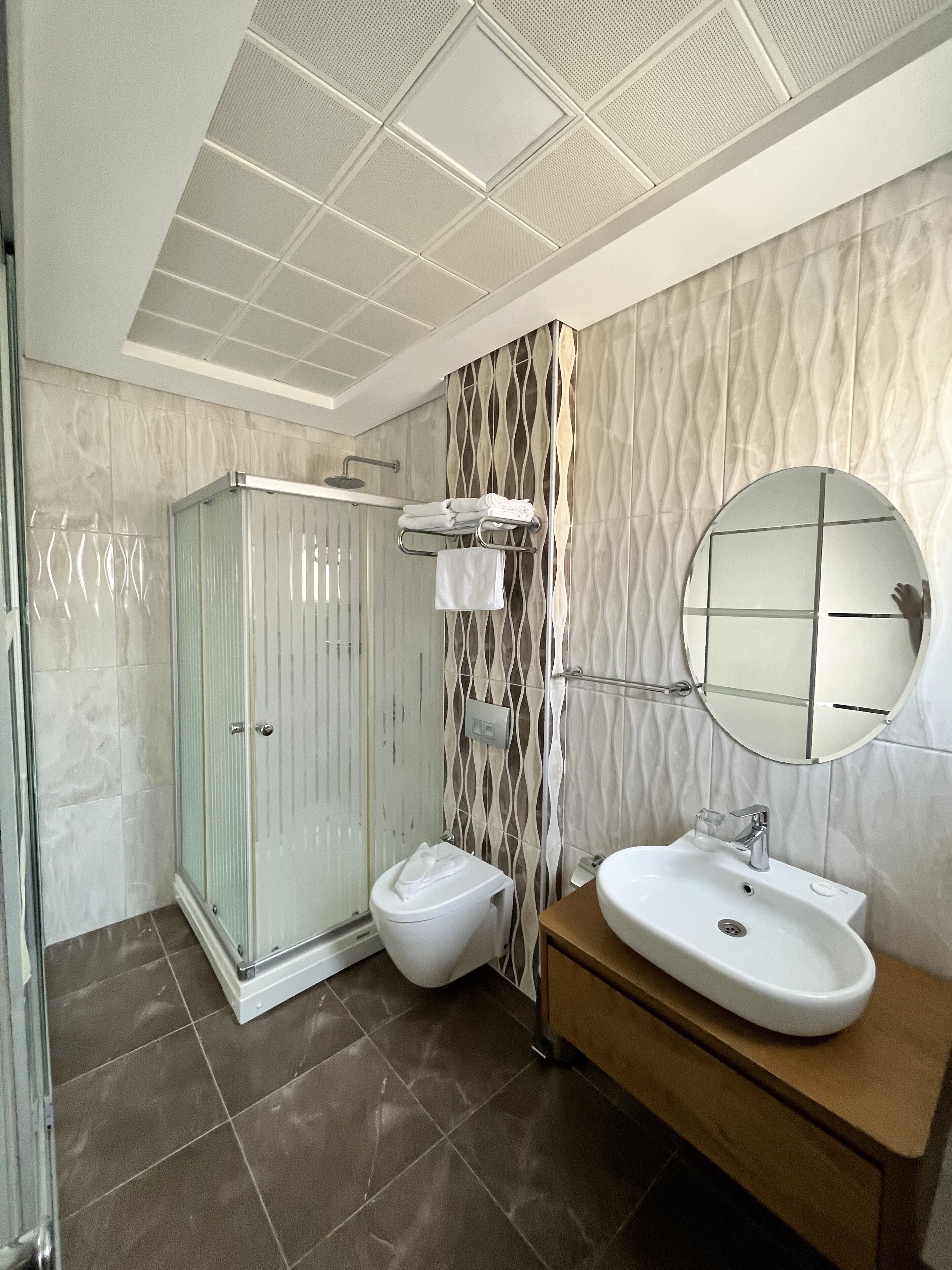 deluxe double room | bathroom | shower, rainfall showerhead, free toiletries, hair dryer