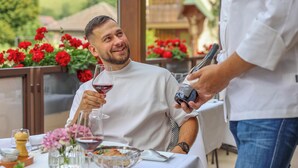 A dining table with a variety of dishes and a wine glass. - Hotel-Gasthaus Goldener Engel (Glottertal)