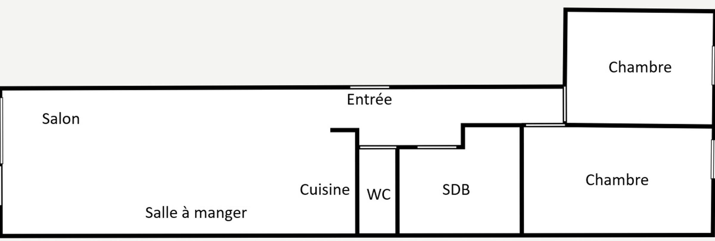 Ein Grundriss mit Salon, Küche, WC, Bad und zwei Zimmern.