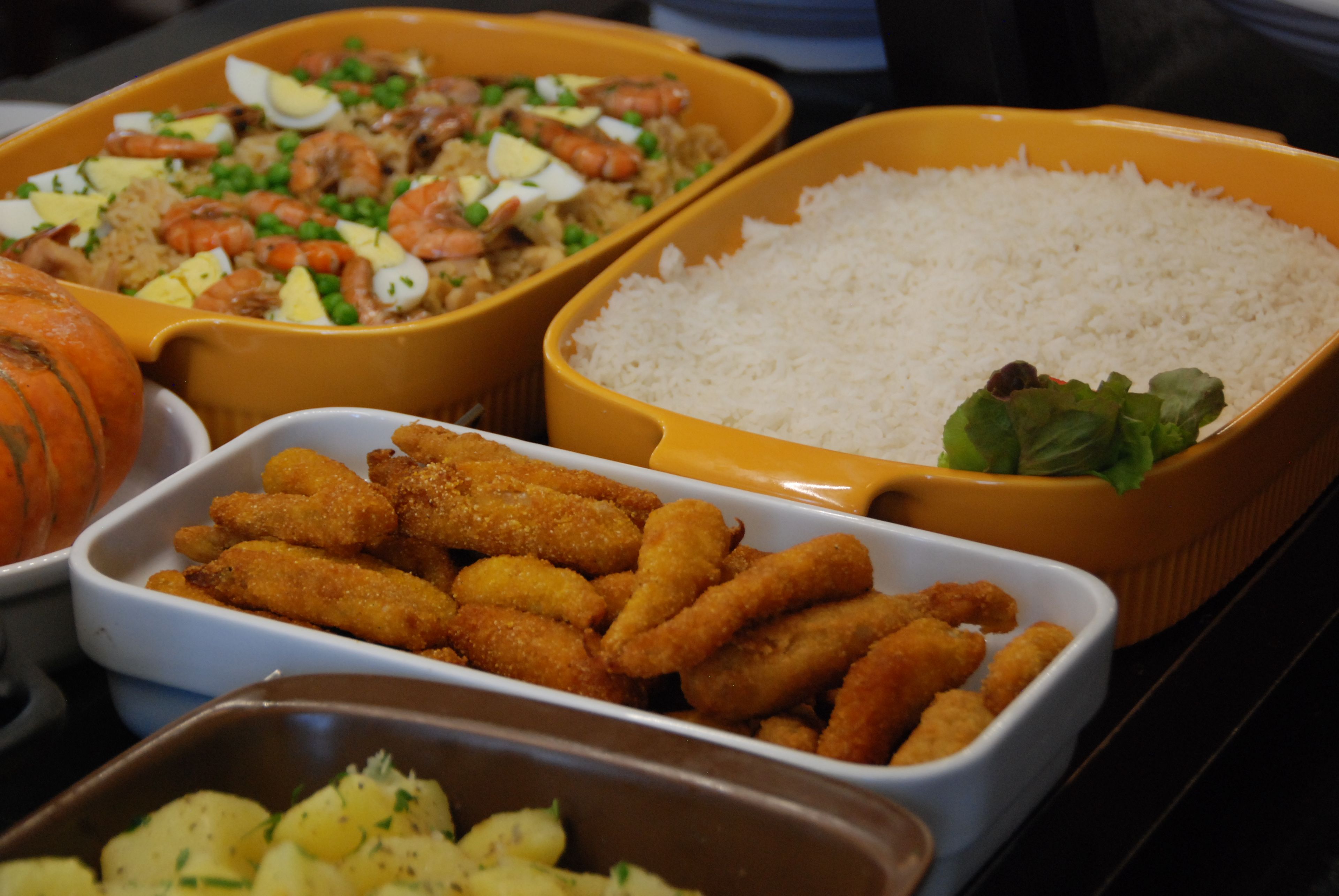 A variety of food dishes in different serving dishes.