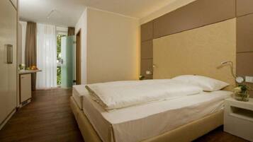 Minibar, desk, blackout drapes, iron/ironing board