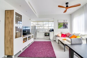Grand Apartment, 2 Bedrooms | Living area | 50-inch flat-screen TV with satellite channels, TV