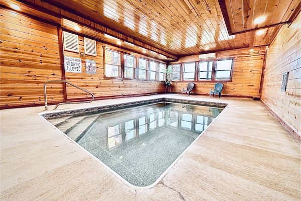 Take a dip in the Heated indoor private pool! 5-6 feet deep on the far end! Find it at The Blissful Bear Lodge!