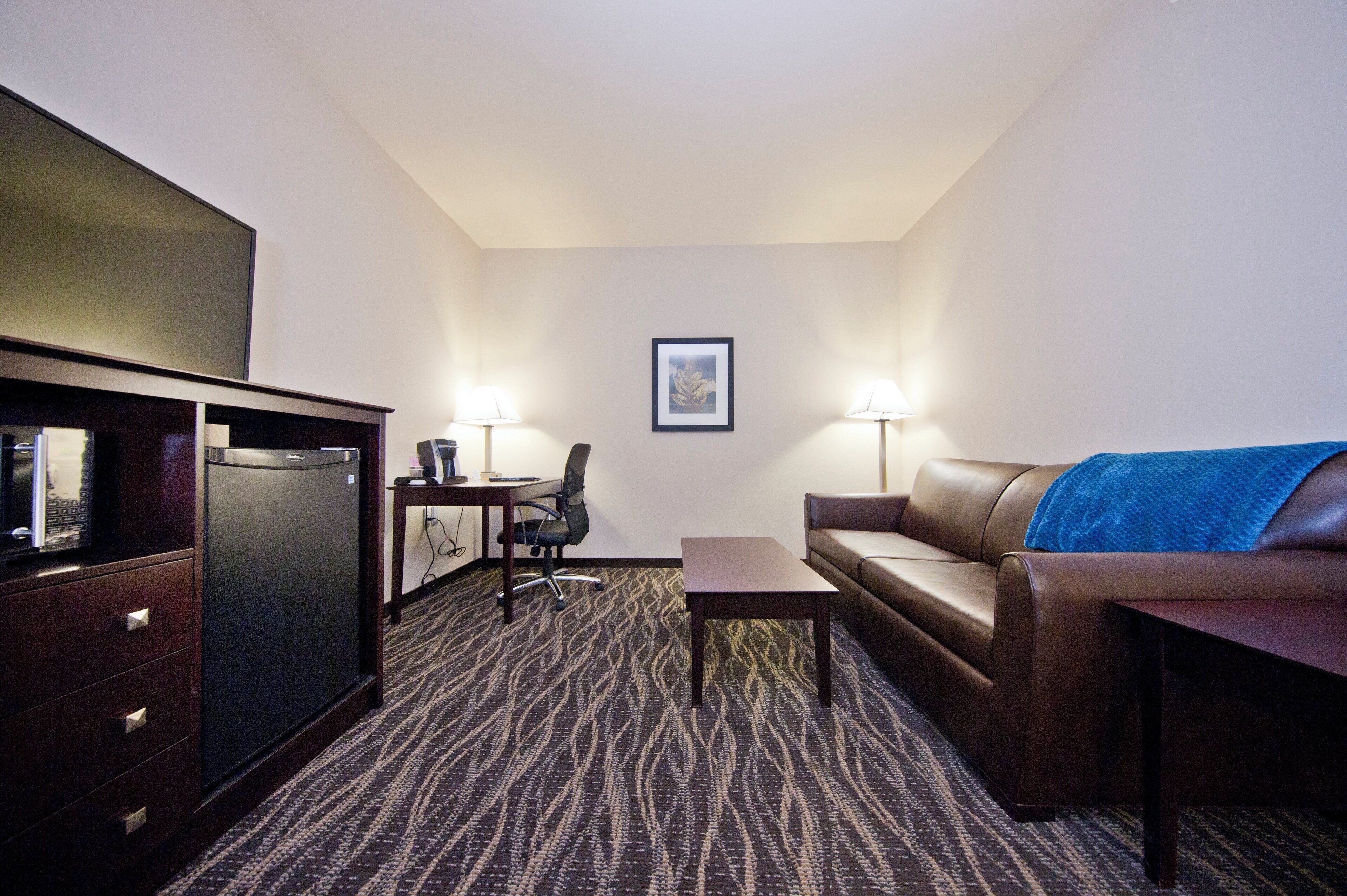 premium bedding, pillow-top beds, desk, laptop workspace