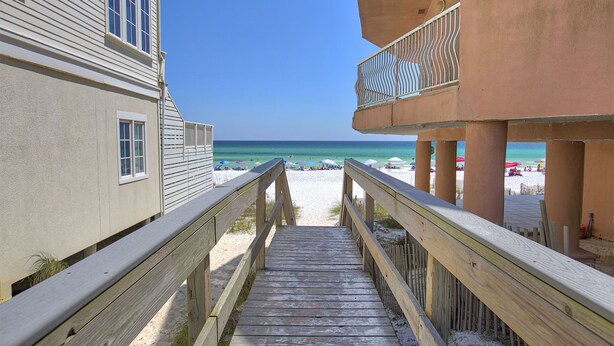 A wooden boardwalk leading to a beach with a clear view of the ocean. - Eden's Estate - Pet Friendly, Heated Community Pool, Bikes Included! (Miramar Beach)