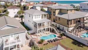 A multi-story hotel with a pool area, including a hot tub and lounge chairs. - Whitesand - Gulf View, Heated Private Pool, Short Walk to the Beach! (Miramar Beach)