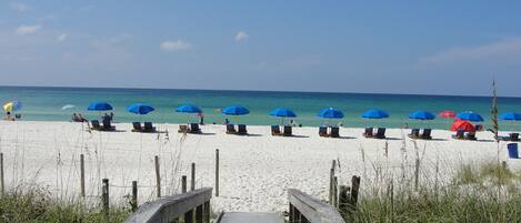 On the beach, sun-loungers