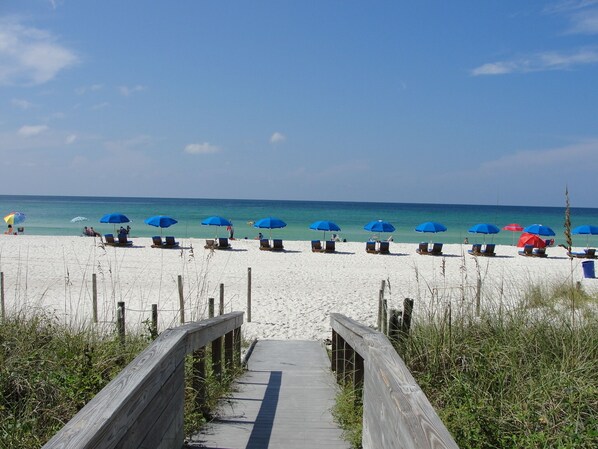 On the beach, sun-loungers