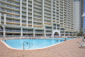 A large hotel with multiple balconies and a central swimming pool area. - Ariel Dunes II 2101 - Great Views, Steps to the Beach, Community Pool! (Miramar Beach)