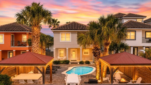 A pool area with a wooden deck, lounge chairs, and a swimming pool. - Breakaway (Updated) - Steps to the Beach! Private Pool! Great Outdoor Space! (Miramar Beach)