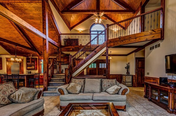 Televisión, chimenea, futbolito y estéreo