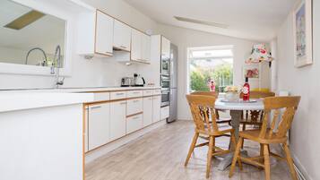 Superior Double Room, Garden Area | Private kitchen | Full-size fridge, microwave, coffee/tea maker, electric kettle