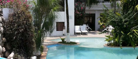 Outdoor pool, open 8:30 AM to 9:30 PM, pool umbrellas