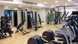 A gym with cardio machines, weight machines, and free weights. - Holiday Inn London Heathrow - Bath Road by IHG (West Drayton)