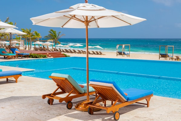 2 outdoor pools, open 9:00 AM to 6:00 PM, pool umbrellas, pool loungers