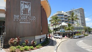 A building with a sign for 'The Surf Club' and 'Moolabala'. - 20 Steps to the Sand! - Beachfront Apartment! No Roads to Cross (Mooloolaba)