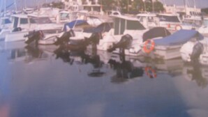 A marina with several boats docked, a building with a red roof, and a clear sky. - Apartment/ flat - DeniaResidential flat (Denia)
