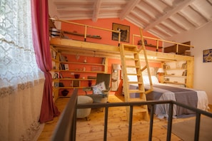 A room with a bunk bed, wooden shelves, a chair, and a ladder. - Vignanova barn in Alta Maremma in Gerfalco (Montieri) (Gerfalco)
