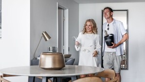 A modern dining area with a round table, chairs, and a lamp. - The Sebel Brisbane Margate Beach (Margate)