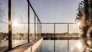 Outdoor pool, open 6:30 AM to 10:00 PM, pool loungers