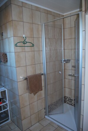 Shower, hair dryer, towels, soap