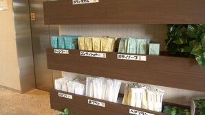A shelf with labeled packages of hair care products. - Green Hotel Yes Nagahama Minatokan (Nagahama)