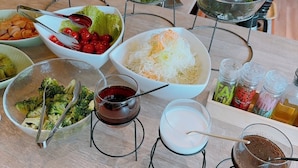 A buffet table with various dishes and condiments. - Green Hotel Yes Nagahama Minatokan (Nagahama)