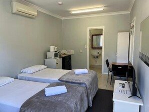 Twin Room | Iron/ironing board, bed sheets