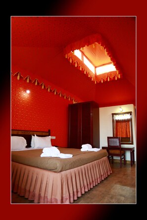 A room with a bed, a chair, a wardrobe, and a mirror. - Besta Ville Tejasvini (Bijaynagar)