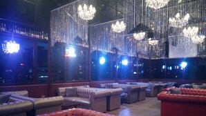 A bar area with plush seating and chandeliers. - Sherar Addis Hotel (Addis Ababa)