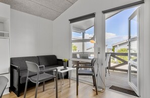 Deluxe Cabin | Living area | Flat-screen TV