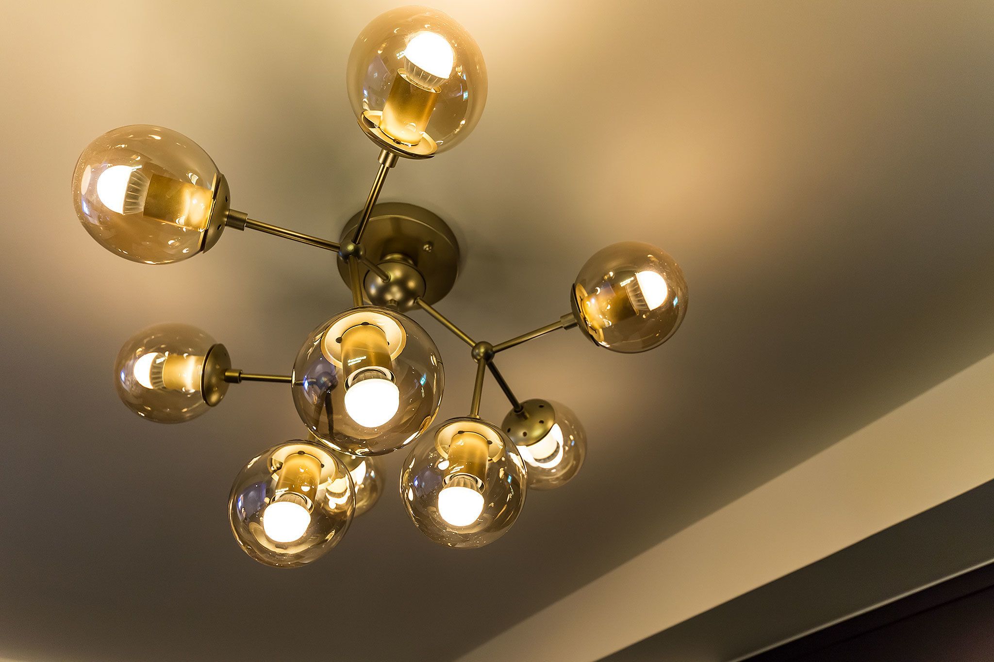 A ceiling light fixture with multiple spherical glass bulbs.